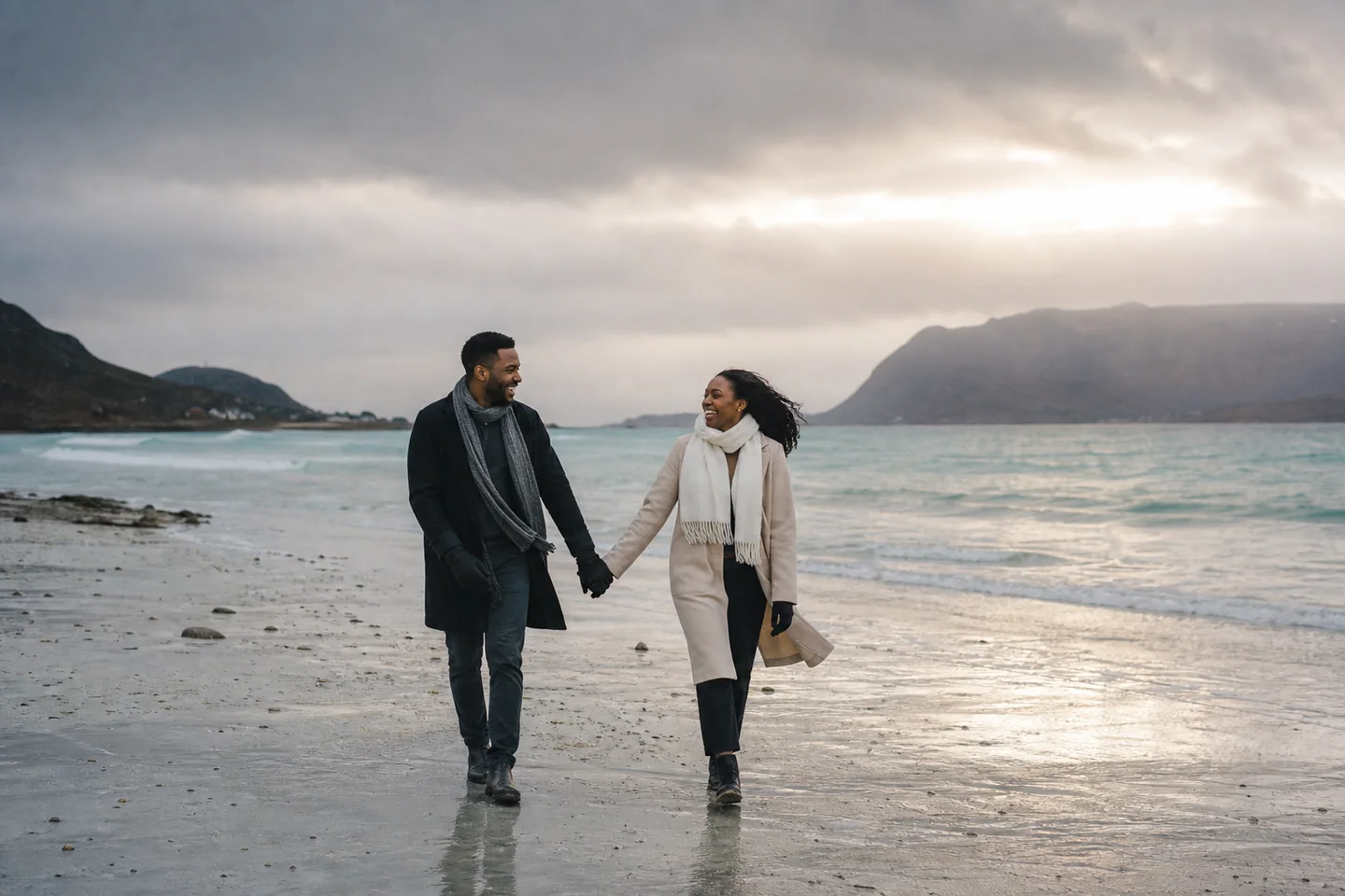 Couple walking on Sommarøy beach after a rain shower